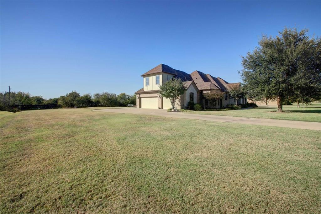 3705 Canyon Pass Trail Burleson, TX 76028 - Photo 31 of 32 a front view of a house with a yard