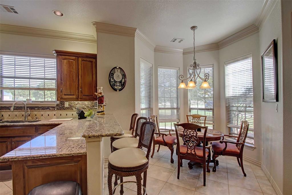 3705 Canyon Pass Trail Burleson, TX 76028 - Photo 7 of 32 a view of a dining room with furniture window and outside view