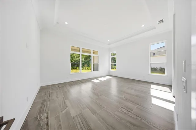 a white bath tub sitting in a bathroom and shower