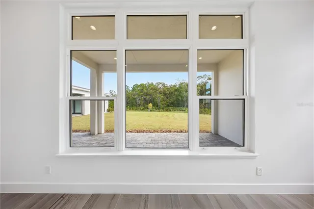 a bathroom with a glass shower door and a sink