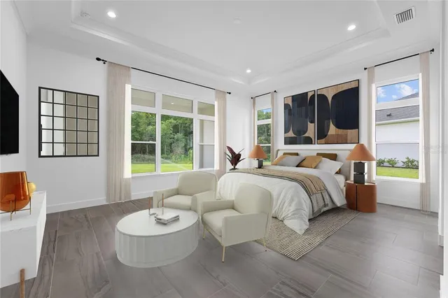 a view of a kitchen with white cabinets