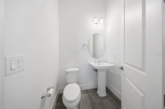 a bed room with a bed and white cabinets