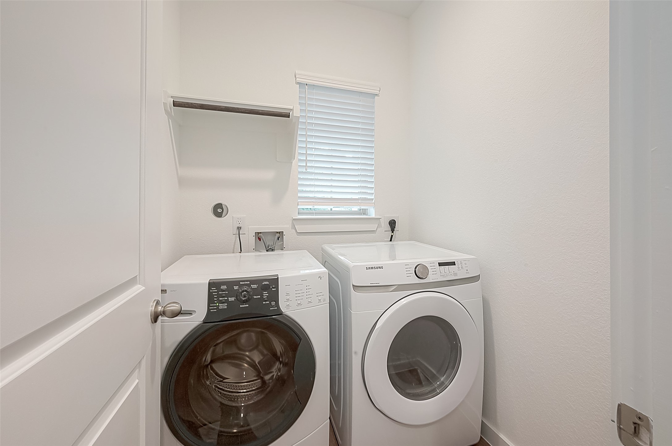 516 Timber Voyage Court Conroe, TX 77304 - Photo 19 of 25 a utility room with dryer and washer
