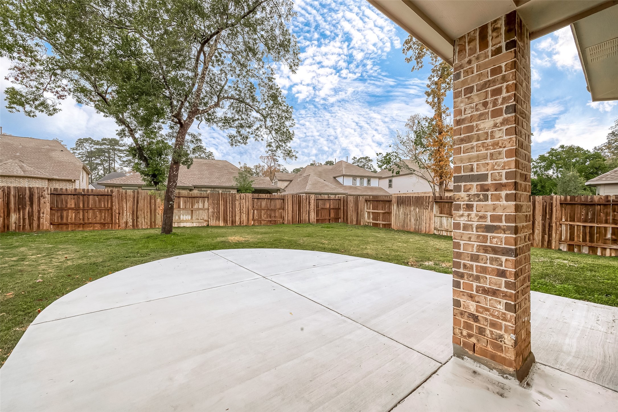 516 Timber Voyage Court Conroe, TX 77304 - Photo 20 of 25 a view of brick house with a yard