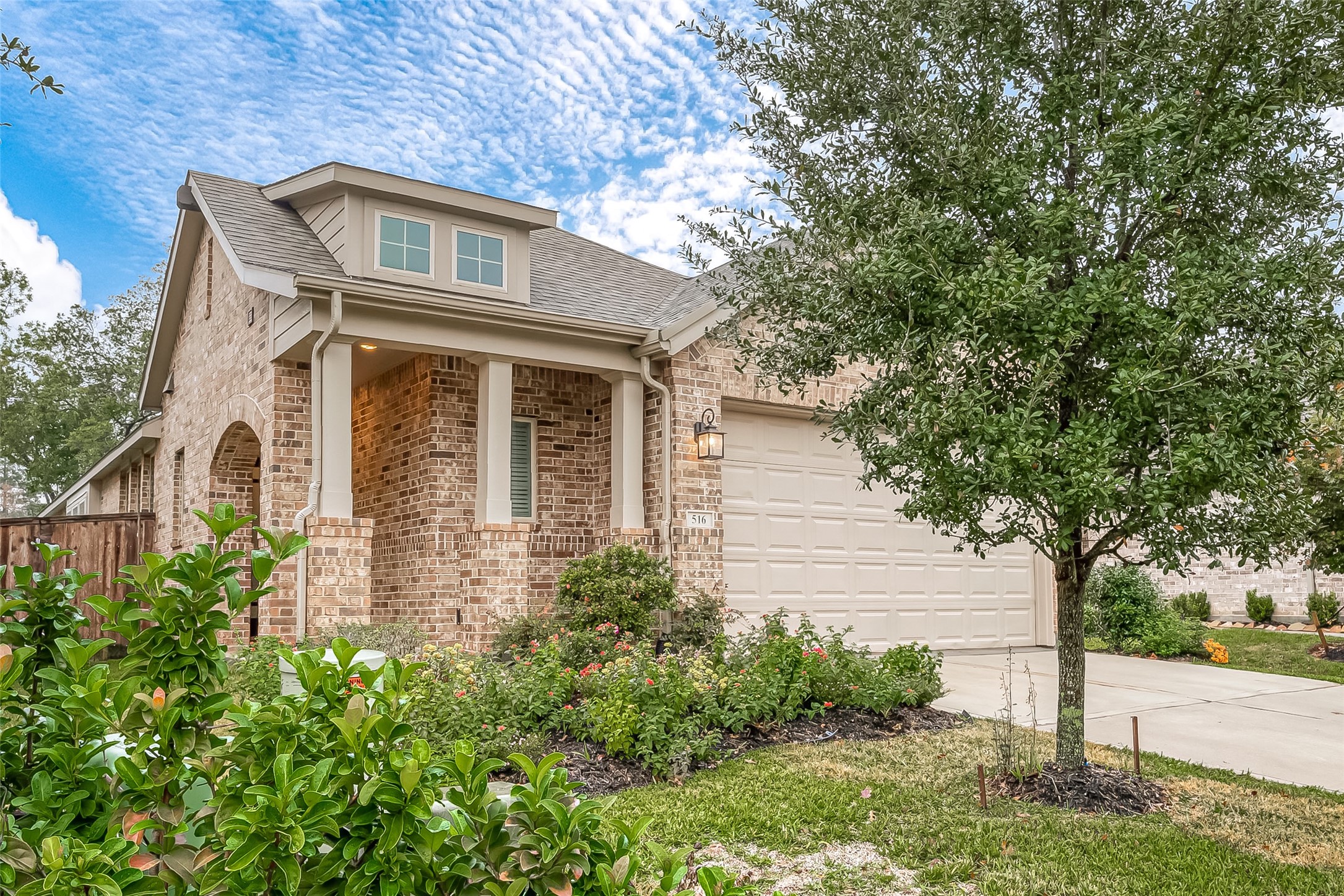 516 Timber Voyage Court Conroe, TX 77304 - Photo 2 of 25 a front view of a house with garden