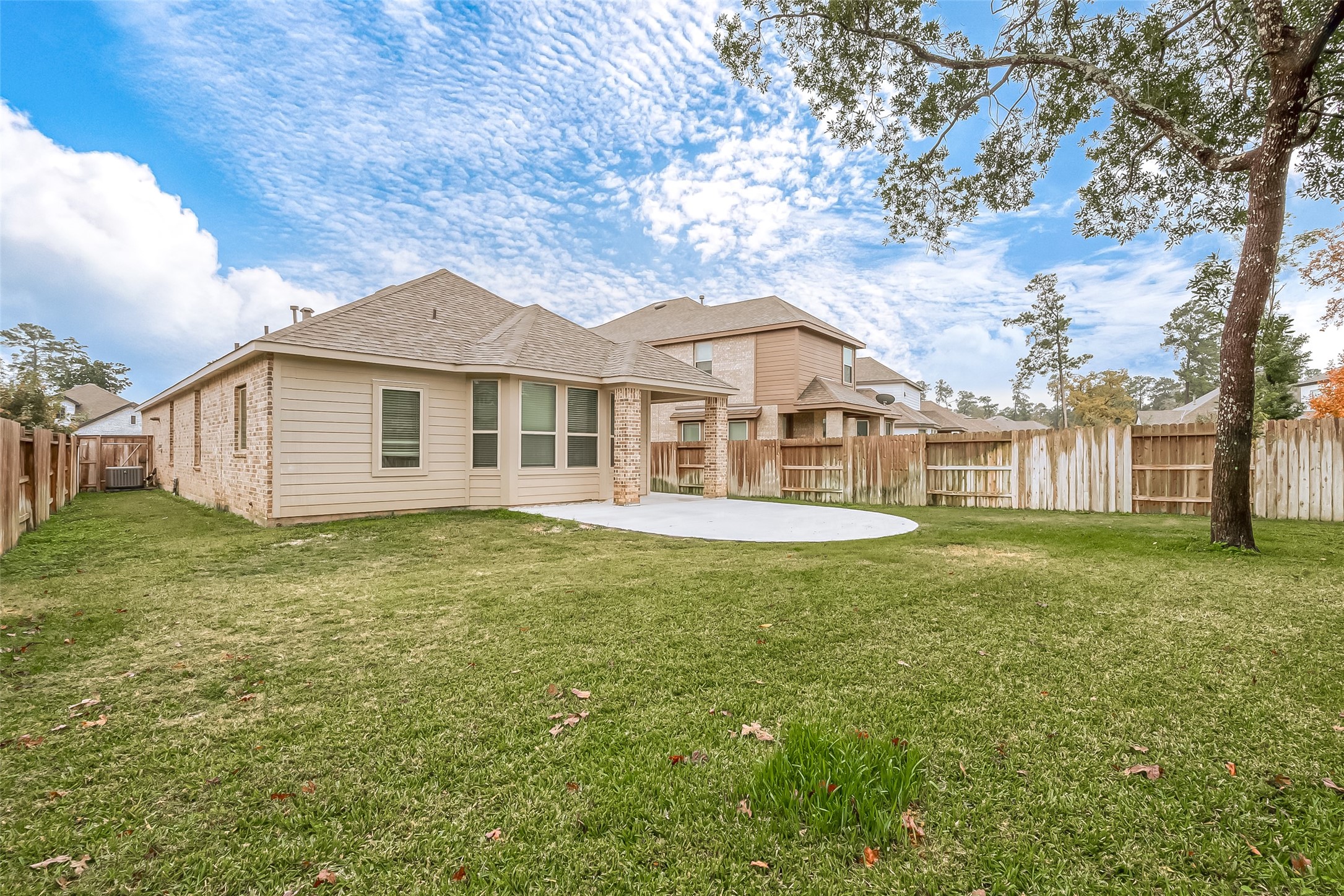 516 Timber Voyage Court Conroe, TX 77304 - Photo 22 of 25 a view of a house with a backyard