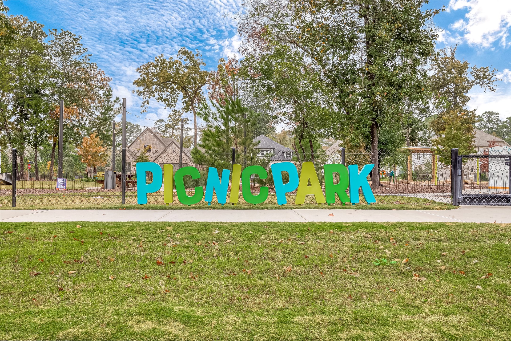 516 Timber Voyage Court Conroe, TX 77304 - Photo 24 of 25 a white house with trees in front of it