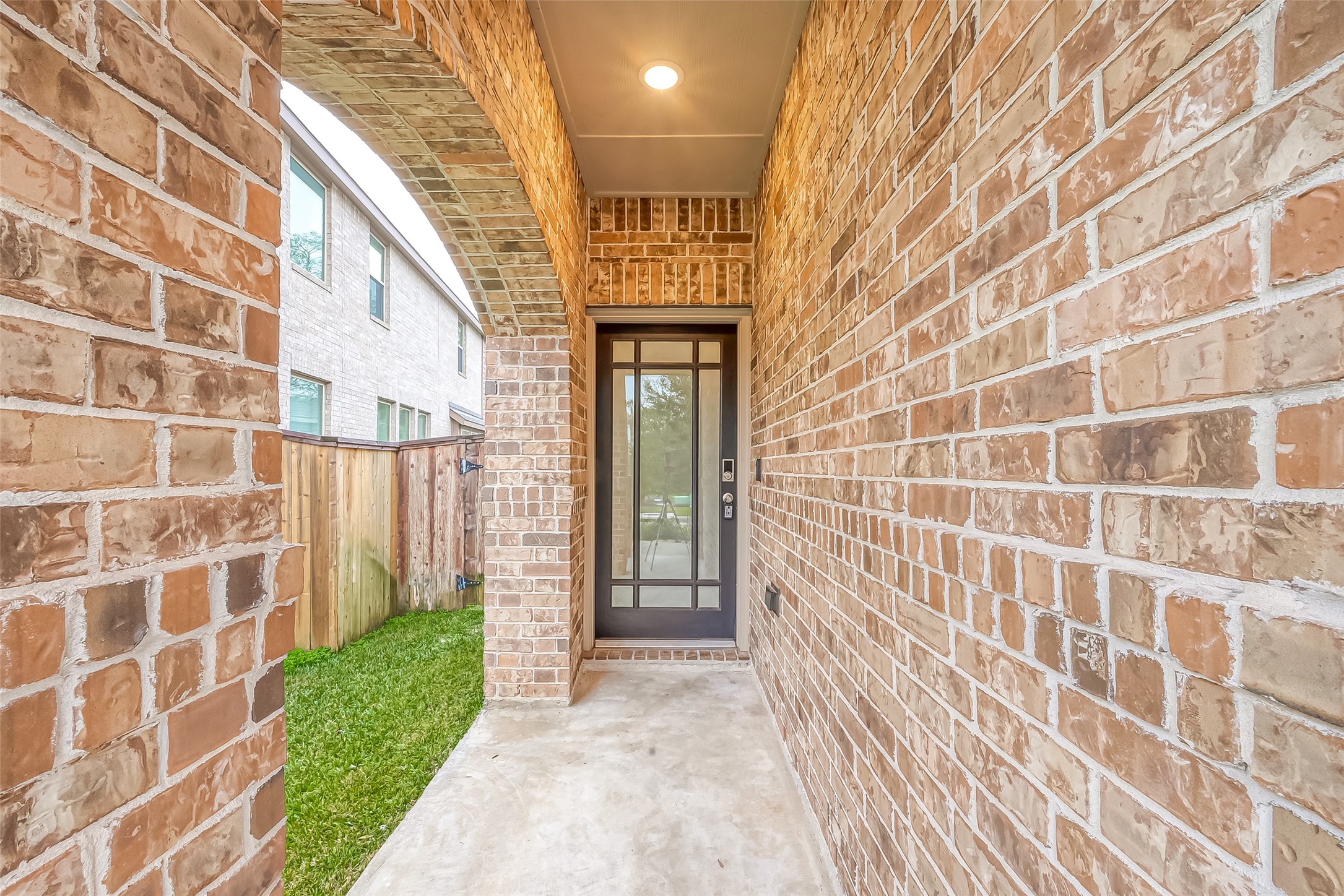 516 Timber Voyage Court Conroe, TX 77304 - Photo 3 of 25 a view of a brick buildings with a door