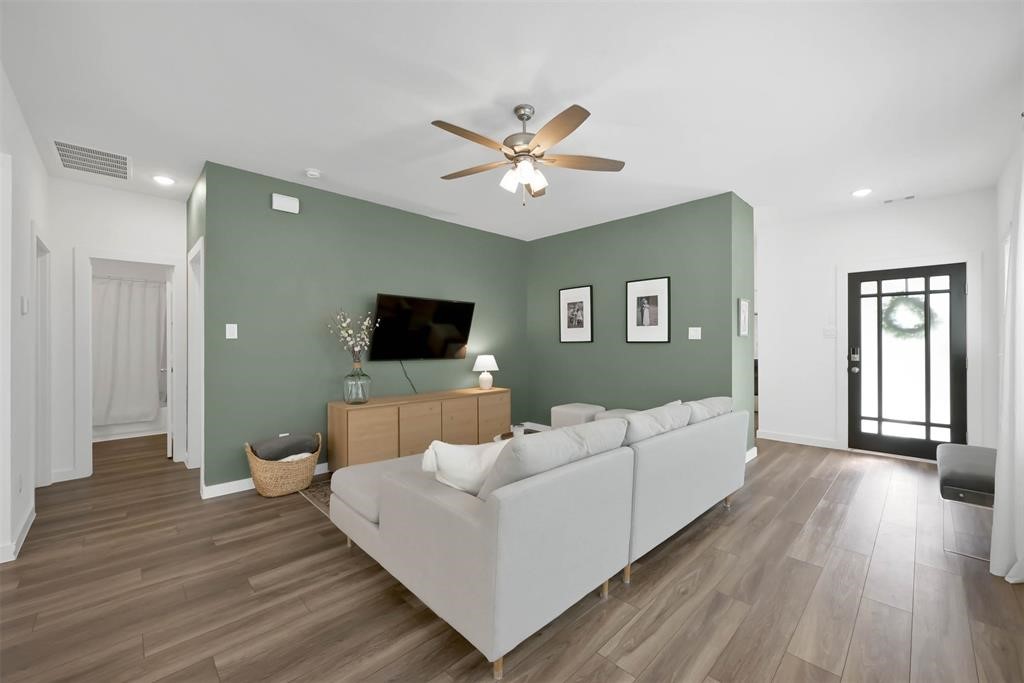 516 Timber Voyage Court Conroe, TX 77304 - Photo 7 of 25 a living room with furniture and a flat screen tv