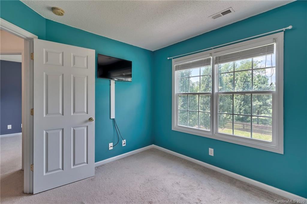 224 Maple Ridge Circle Salisbury, NC 28147 - Photo 34 of 43 a view of an empty room with a window and a kitchen