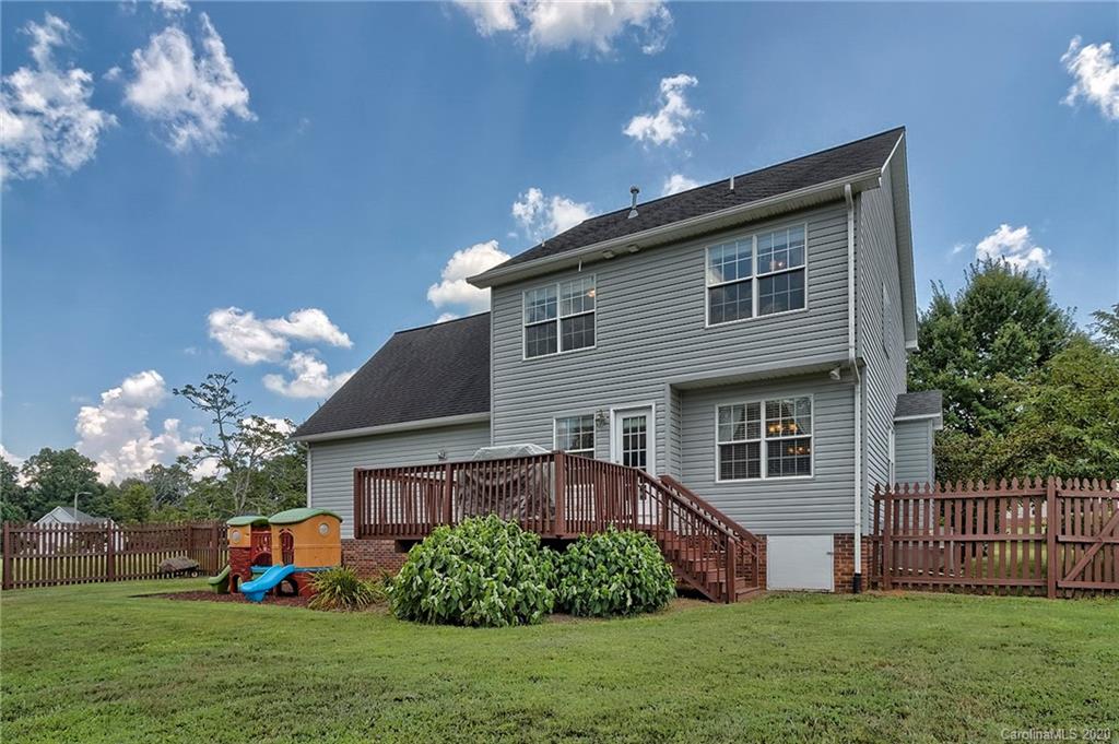 224 Maple Ridge Circle Salisbury, NC 28147 - Photo 7 of 43 a front view of a house with a yard table and chairs