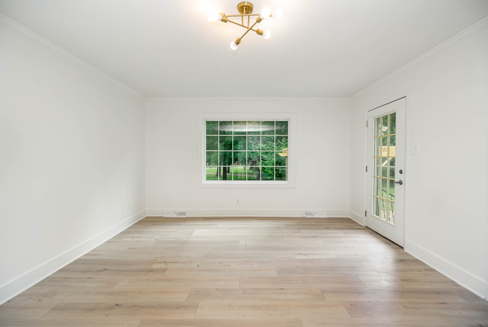 1401 Manor Road Columbia, TN 38401 - Photo 12 of 35 wooden floor in an empty room with a window