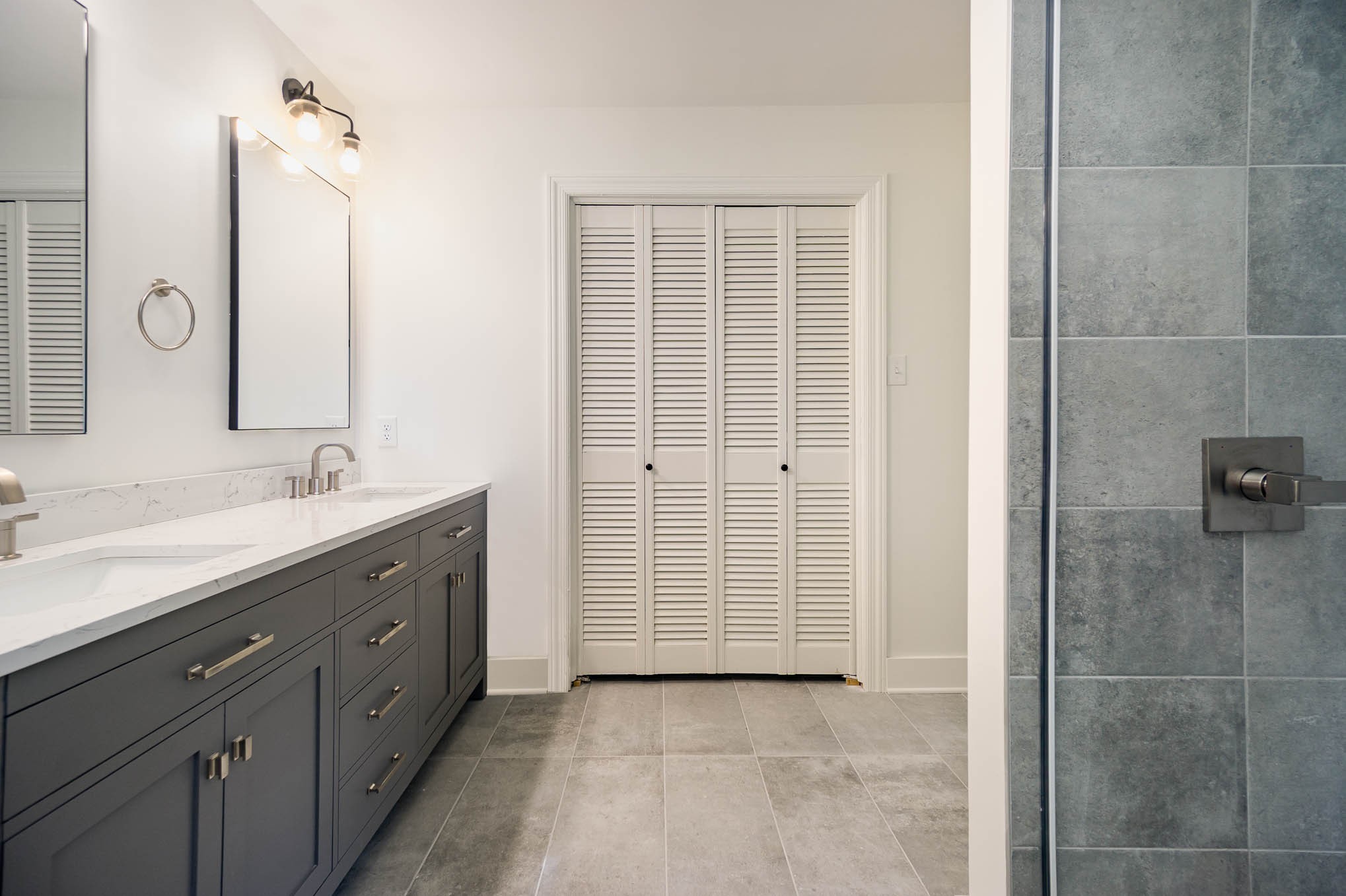 1401 Manor Road Columbia, TN 38401 - Photo 16 of 35 a spacious bathroom with a granite countertop sink a mirror and shower