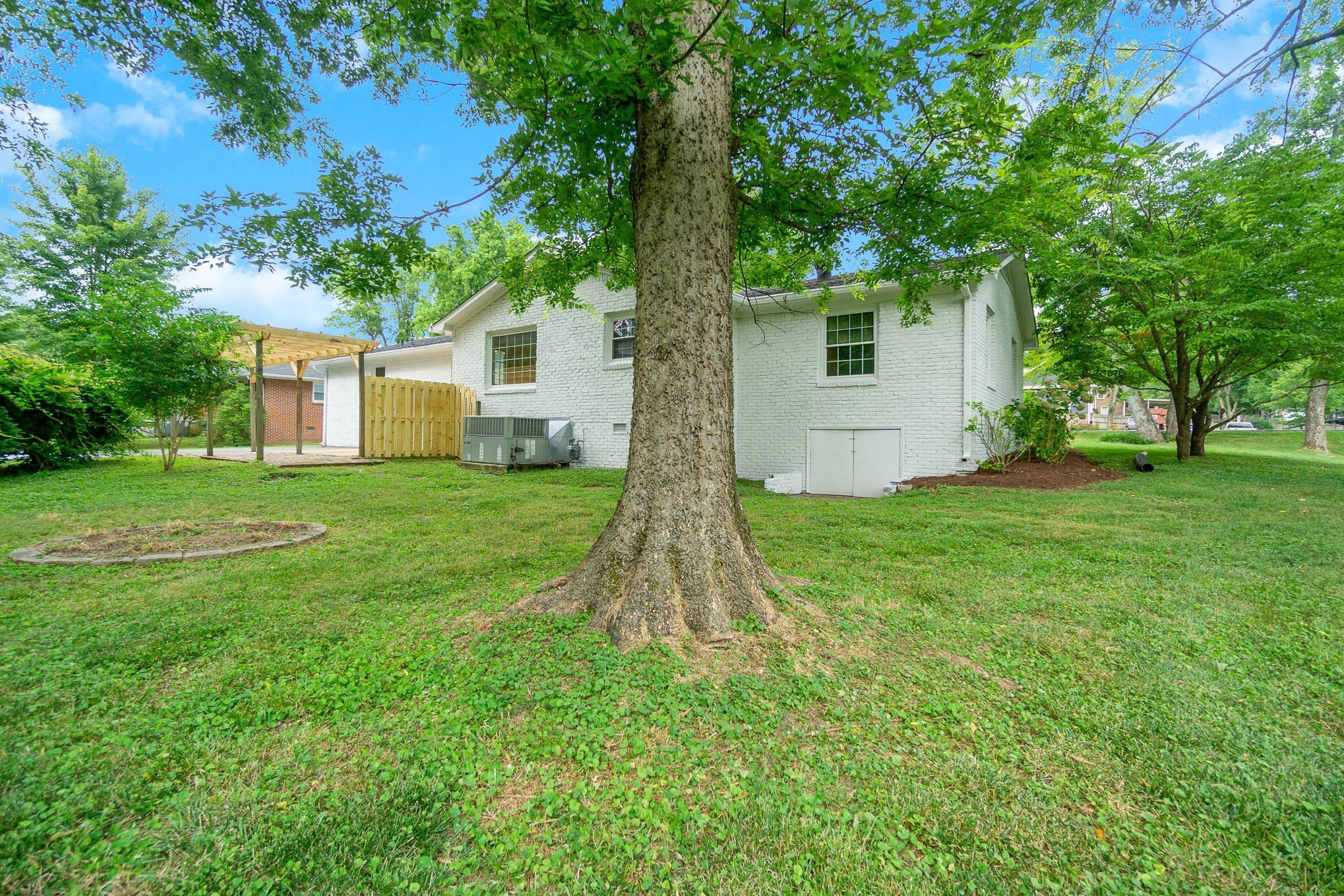 1401 Manor Road Columbia, TN 38401 - Photo 34 of 35 a view of a house with a tree and garden