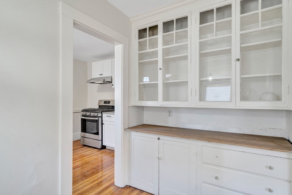 18-20 Walcott Road Watertown, MA 02472 - Photo 13 of 40 a kitchen with cabinets appliances and a window