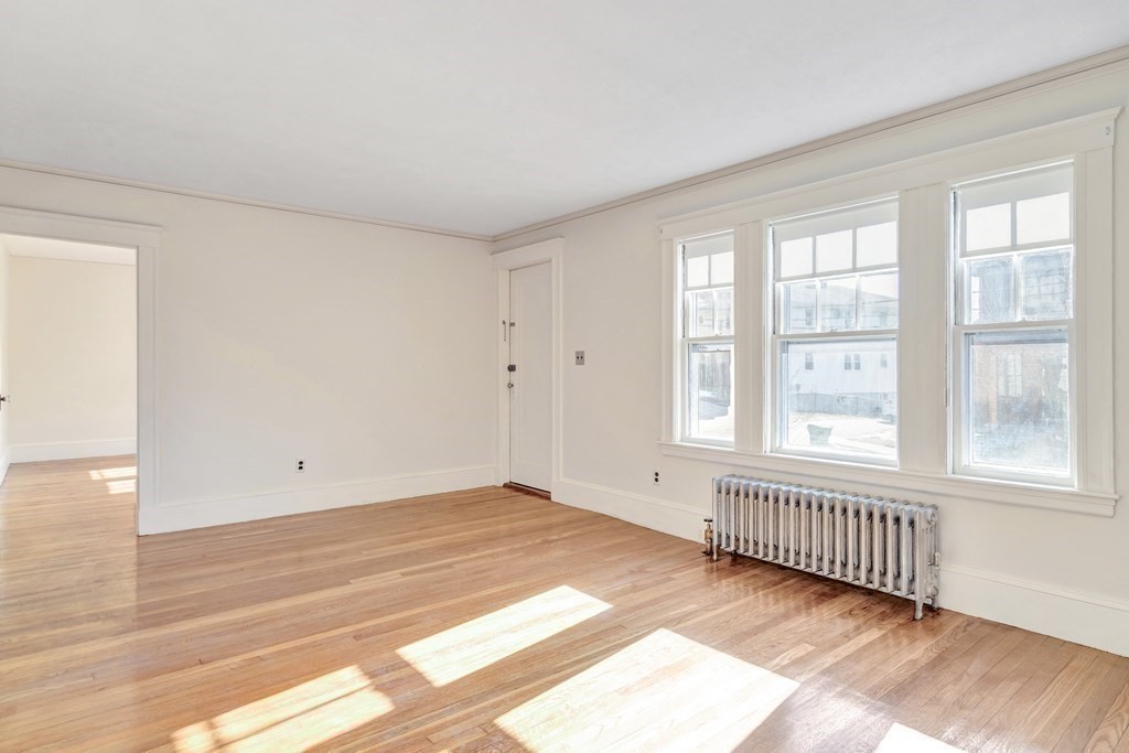 18-20 Walcott Road Watertown, MA 02472 - Photo 4 of 40 a view of an empty room with a window