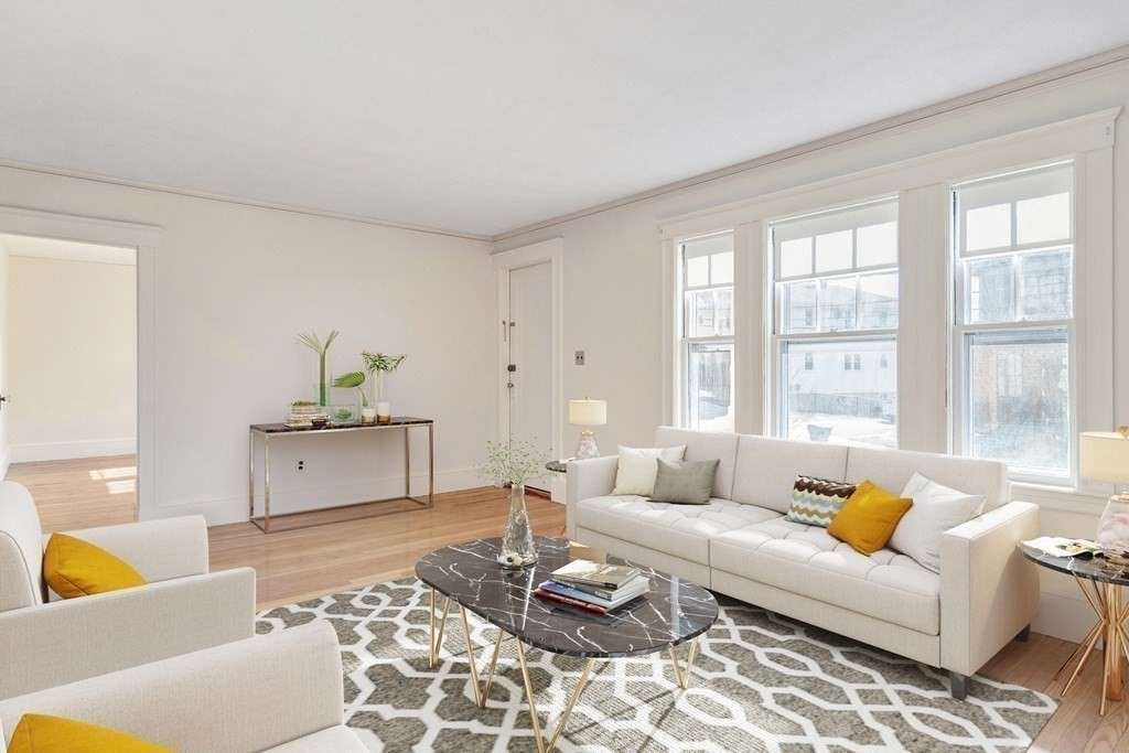 18-20 Walcott Road Watertown, MA 02472 - Photo 5 of 40 a living room with furniture and a potted plant