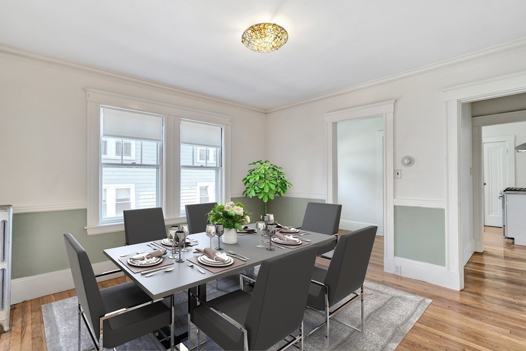 18-20 Walcott Road Watertown, MA 02472 - Photo 10 of 40 a view of a dining room with a table and chairs