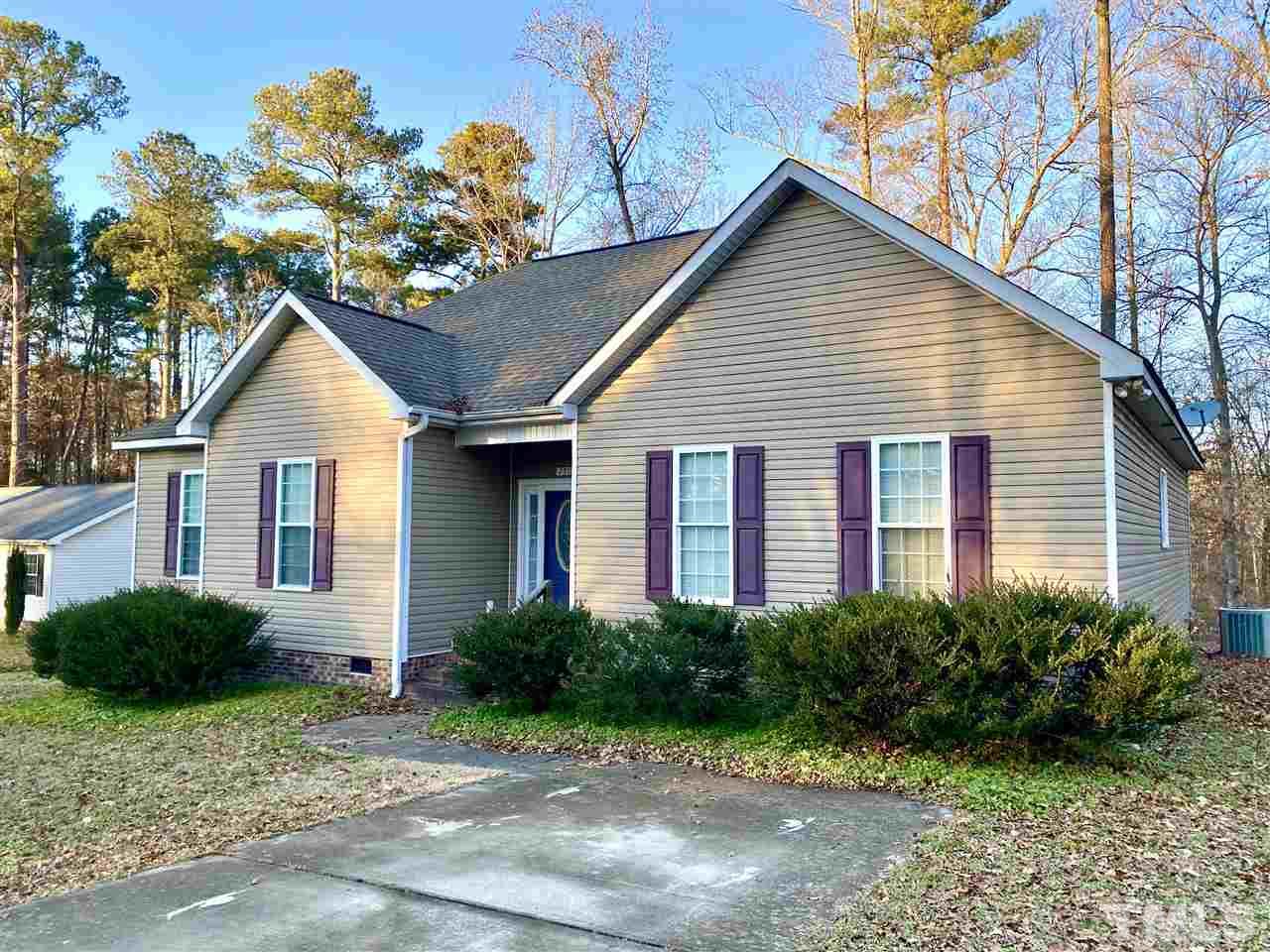 2513 Friendly Trail Raleigh, NC 27610 - Photo 2 of 29 a front view of a house with garden