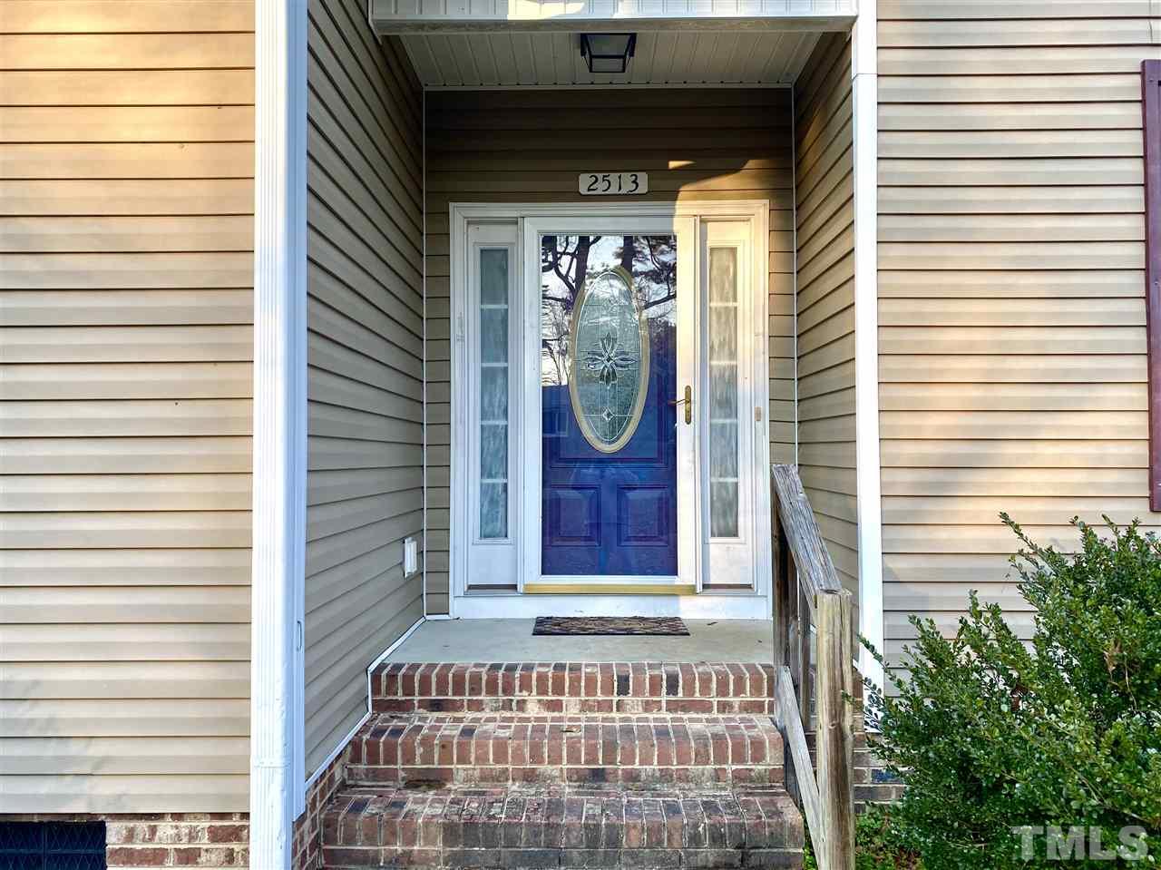 2513 Friendly Trail Raleigh, NC 27610 - Photo 3 of 29 a front view of a house with a porch