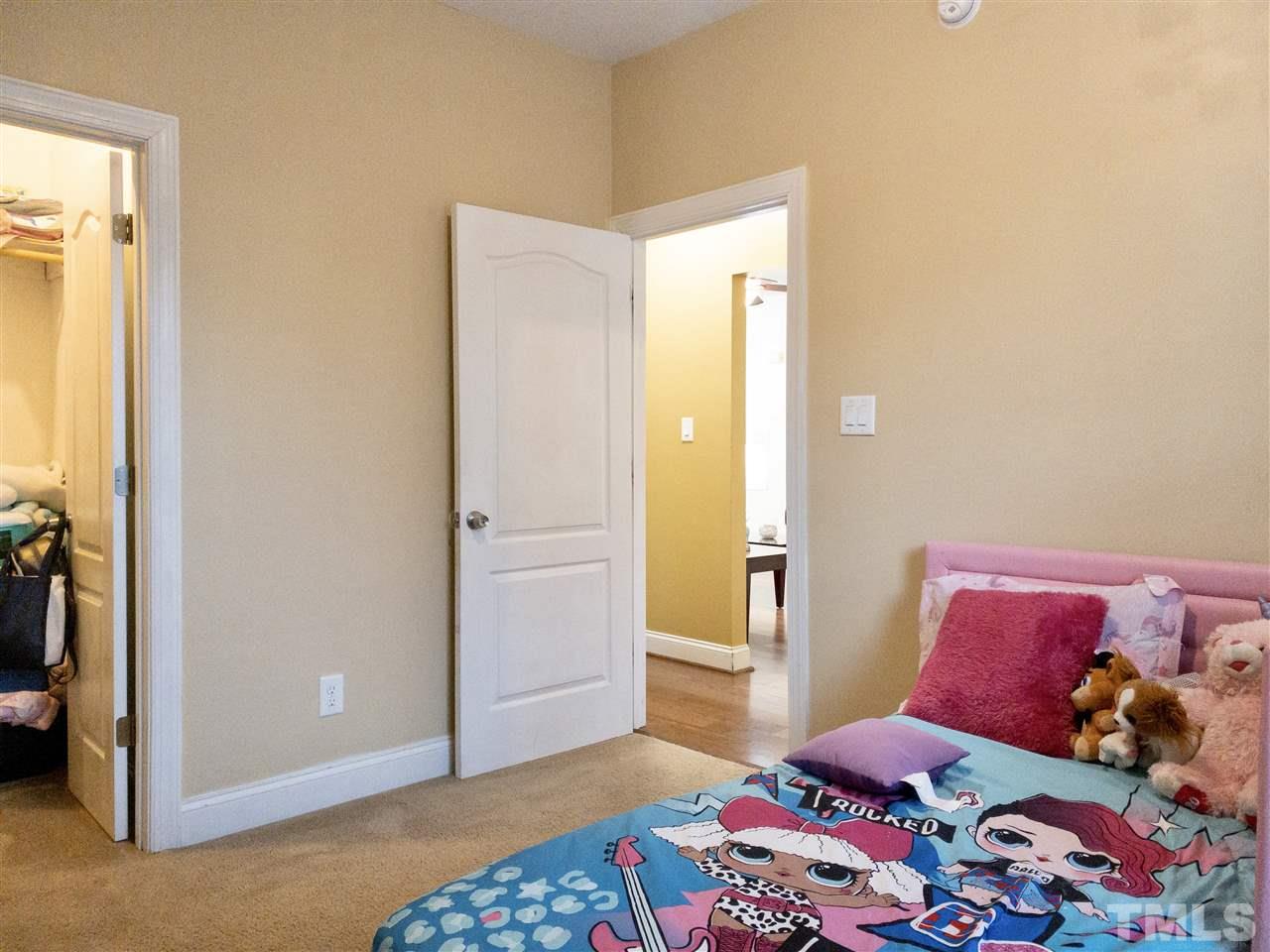 2513 Friendly Trail Raleigh, NC 27610 - Photo 23 of 29 a bedroom with a bed and a window