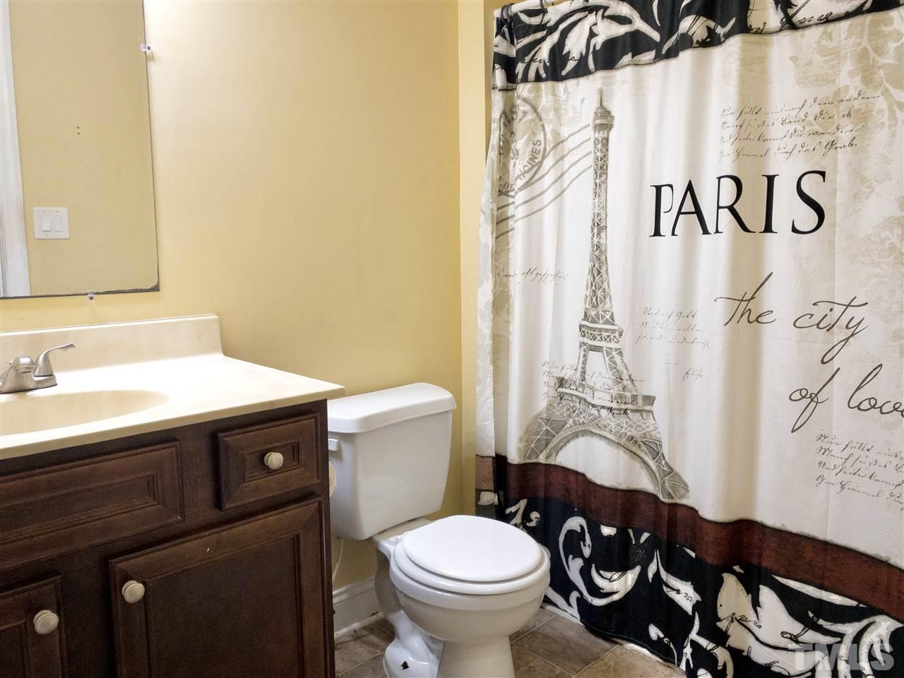 2513 Friendly Trail Raleigh, NC 27610 - Photo 24 of 29 a bathroom with a sink and a toilet
