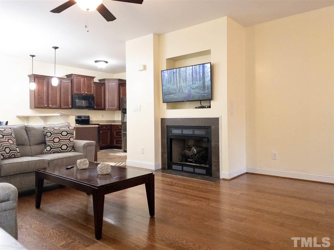 2513 Friendly Trail Raleigh, NC 27610 - Photo 7 of 29 a living room with furniture and a fireplace