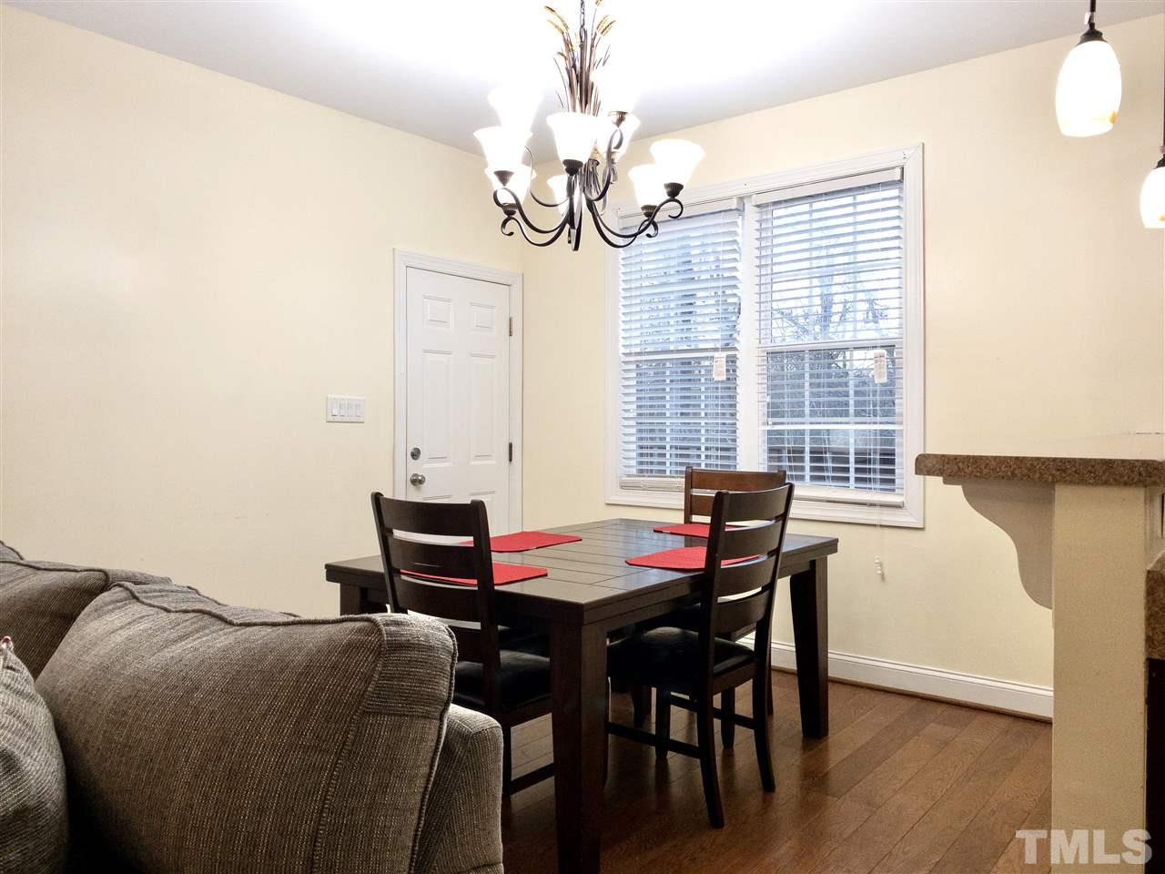 2513 Friendly Trail Raleigh, NC 27610 - Photo 9 of 29 a view of a dining room with furniture and window