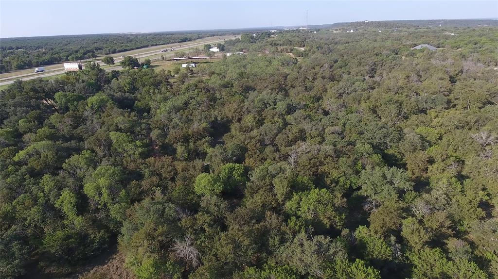 20 Ih Santo, TX 76472 - Photo 25 of 38 Aerial overview of property's location featuring a heavily wooded area