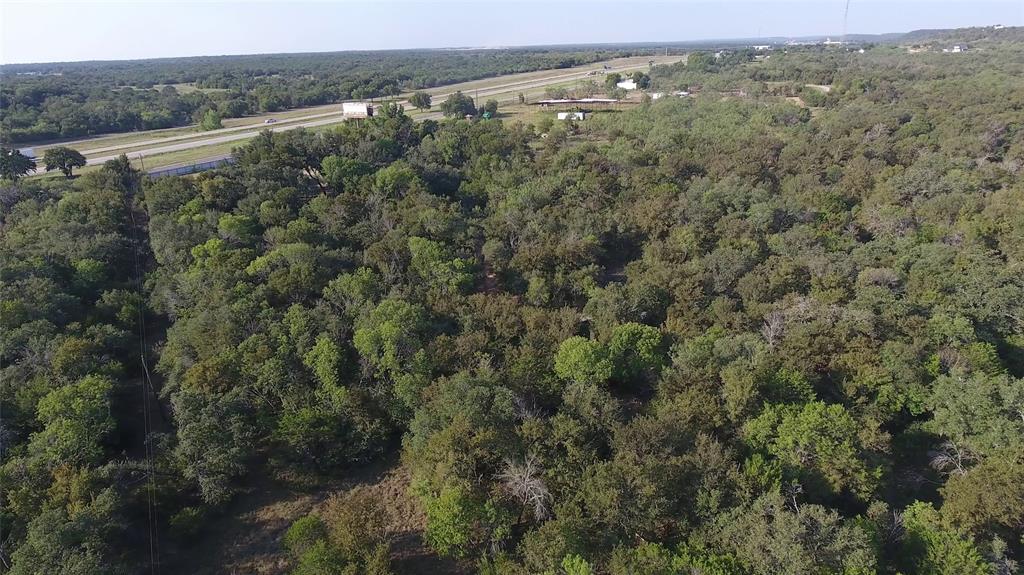 20 Ih Santo, TX 76472 - Photo 27 of 38 View of property location with a heavily wooded area