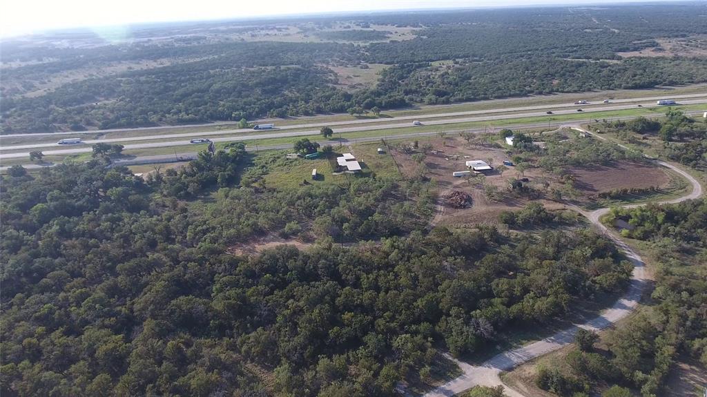 20 Ih Santo, TX 76472 - Photo 3 of 38 Aerial overview of property's location featuring a heavily wooded area