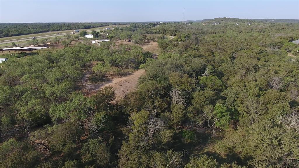 20 Ih Santo, TX 76472 - Photo 10 of 38 View of property location featuring a heavily wooded area