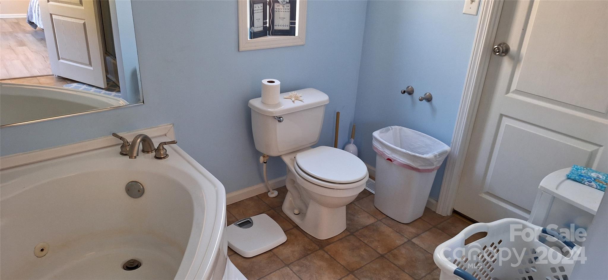 4094 Lefevers Road Vale, NC 28168 - Photo 12 of 47 a white toilet sitting next to a bath tub