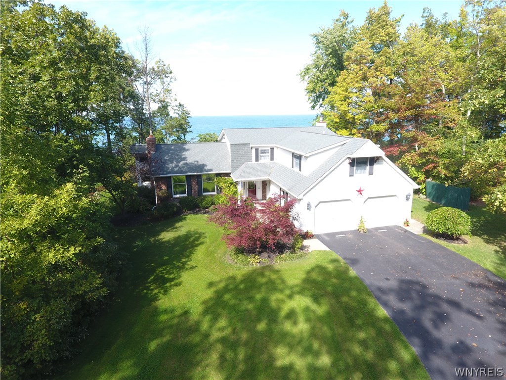 629 Lake Road Porter, NY 14174 - Photo 1 of 35 Aerial view of house with Lake Ontario in backgrou