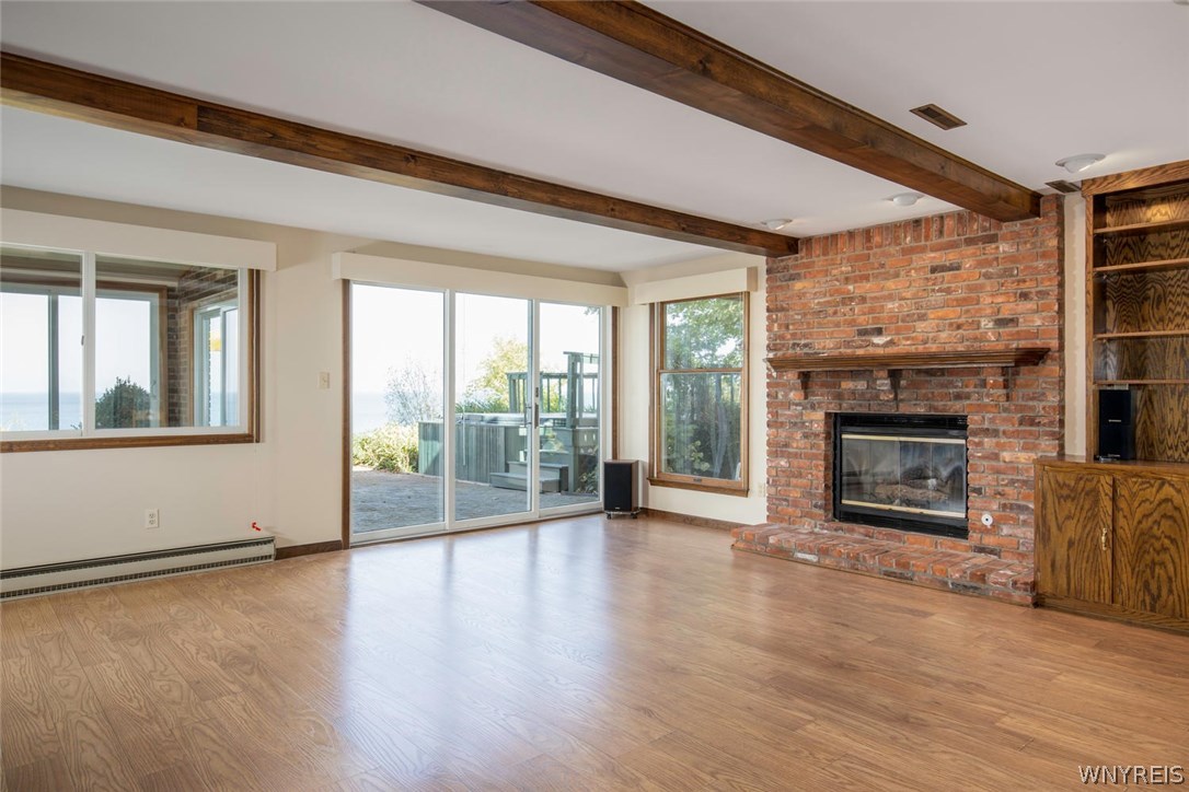 629 Lake Road Porter, NY 14174 - Photo 14 of 35 Family room with vent free propane fired gas log f