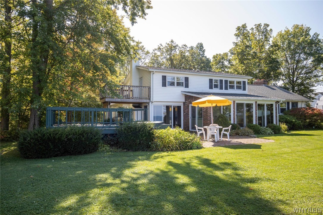 629 Lake Road Porter, NY 14174 - Photo 26 of 35 View of back of house featuring a brick patio. dec