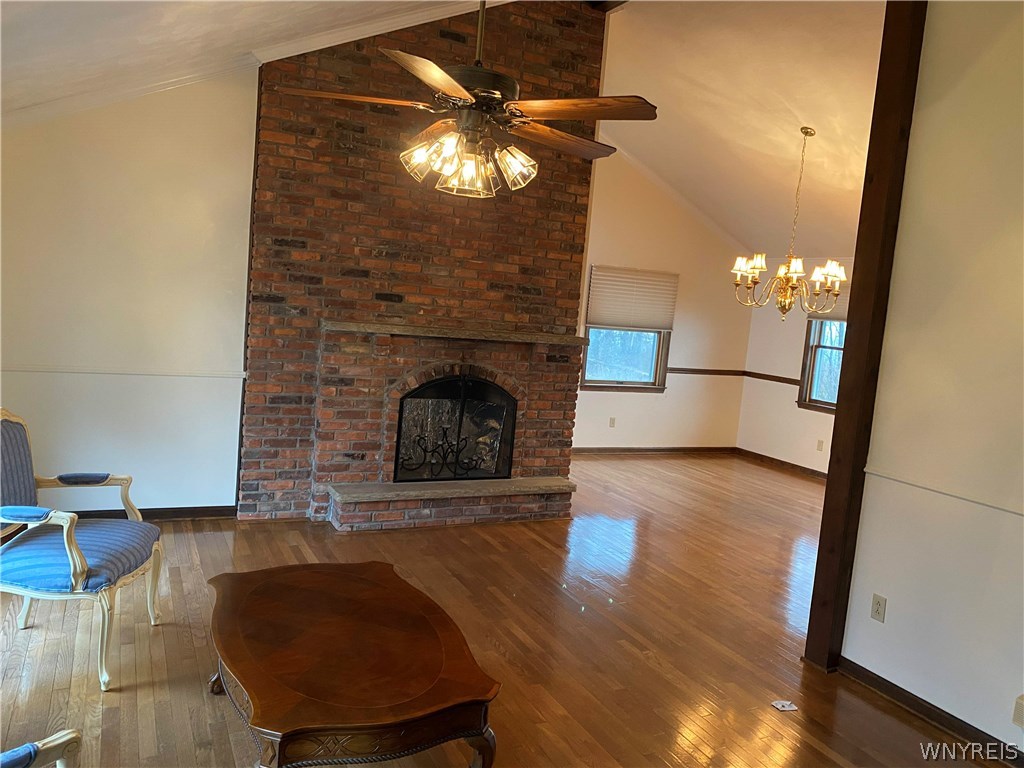 629 Lake Road Porter, NY 14174 - Photo 6 of 35 Living Room with wood burning fireplace and dining