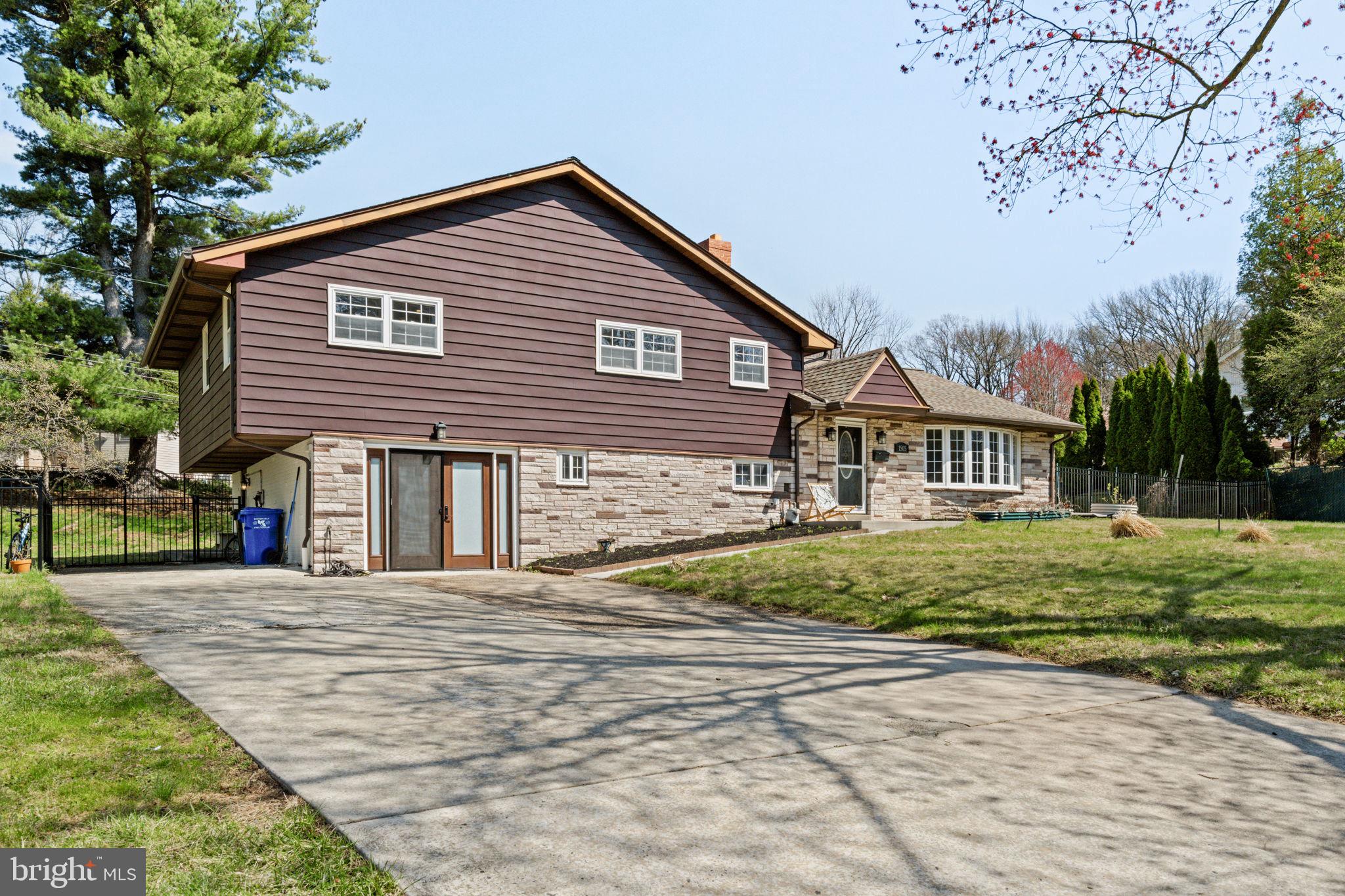 1505 Redwood Lane Wyncote, PA 19095 - Photo 1 of 51 a front view of a house with a yard