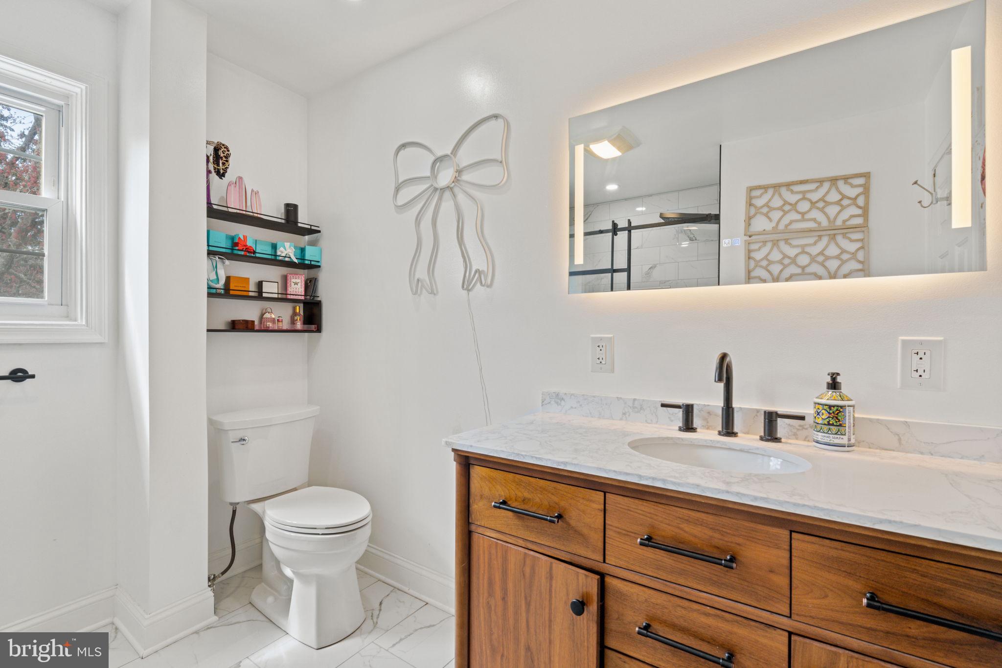 1505 Redwood Lane Wyncote, PA 19095 - Photo 17 of 51 a bathroom with a toilet sink and mirror