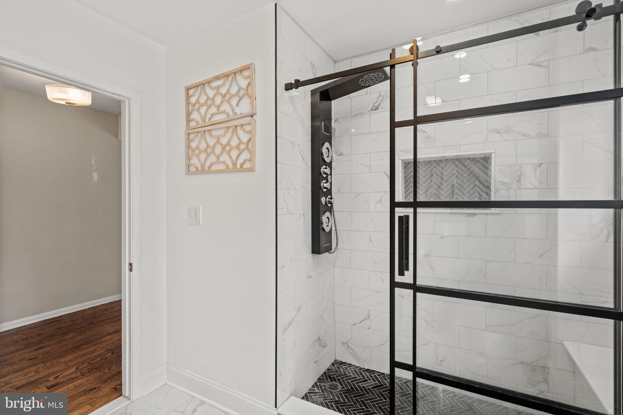 1505 Redwood Lane Wyncote, PA 19095 - Photo 18 of 51 a bathroom with a shower and a glass door