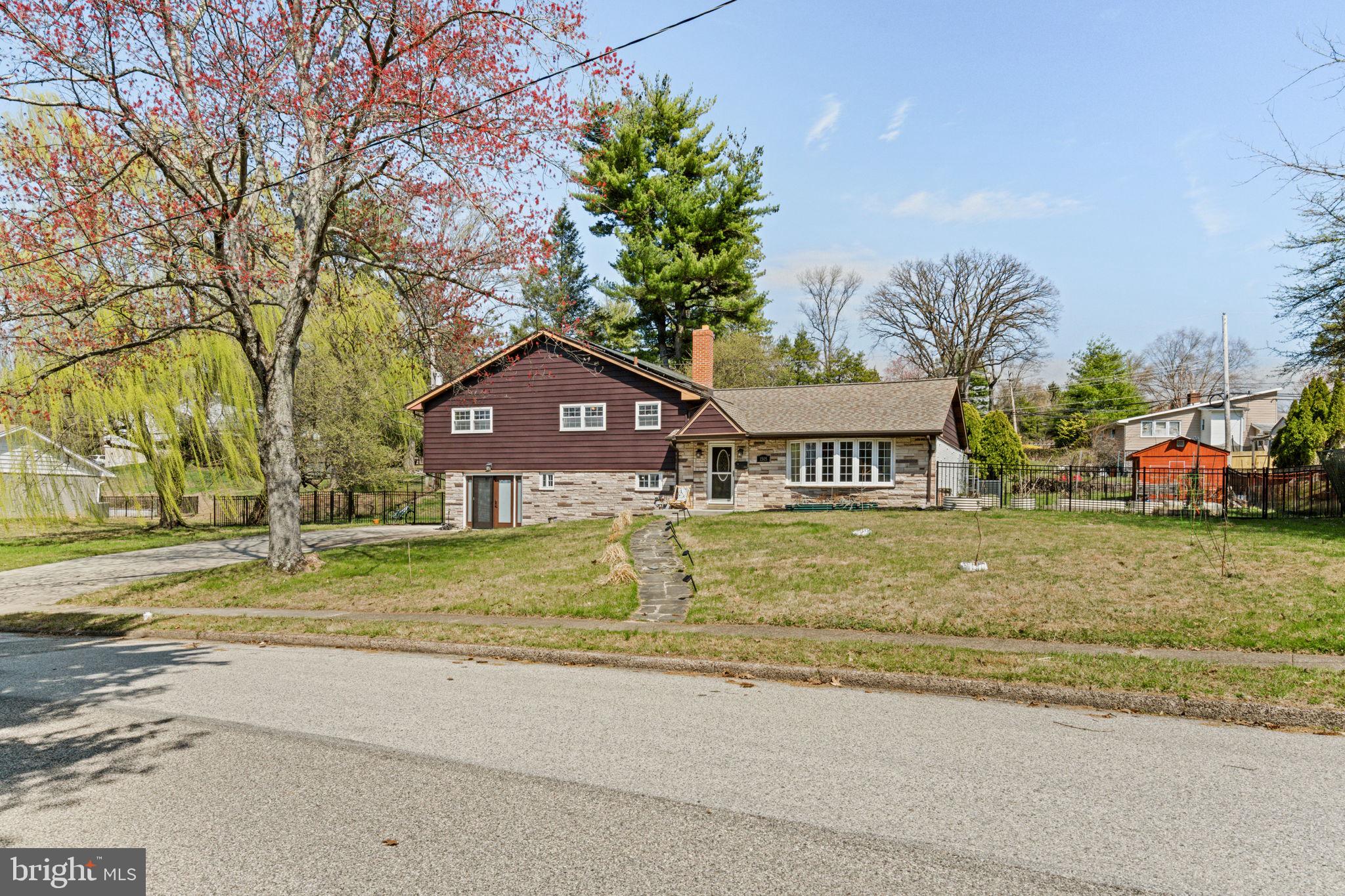 1505 Redwood Lane Wyncote, PA 19095 - Photo 2 of 51 a view of house with a yard and large trees