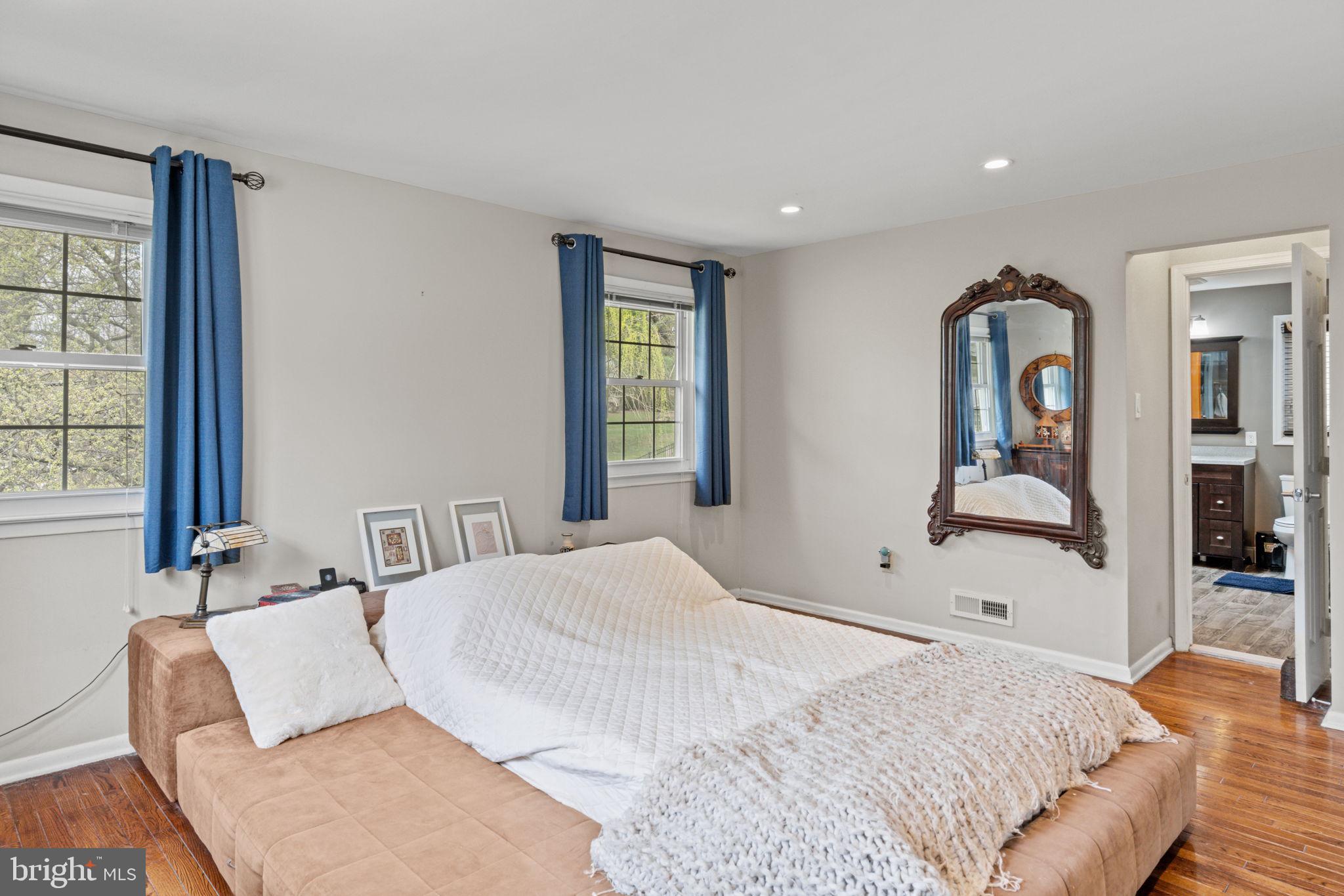 1505 Redwood Lane Wyncote, PA 19095 - Photo 28 of 51 a bedroom with a bed and dresser with mirror