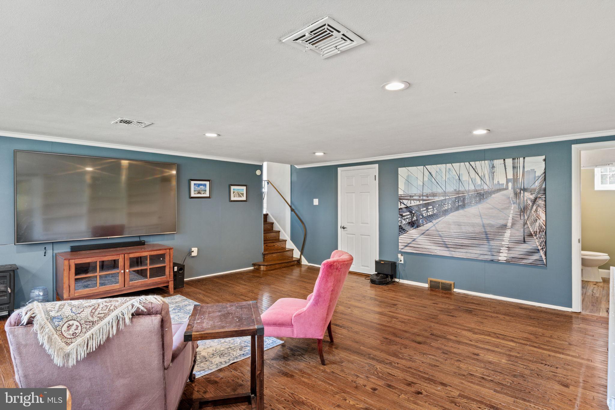 1505 Redwood Lane Wyncote, PA 19095 - Photo 35 of 51 a room with furniture and a flat screen tv