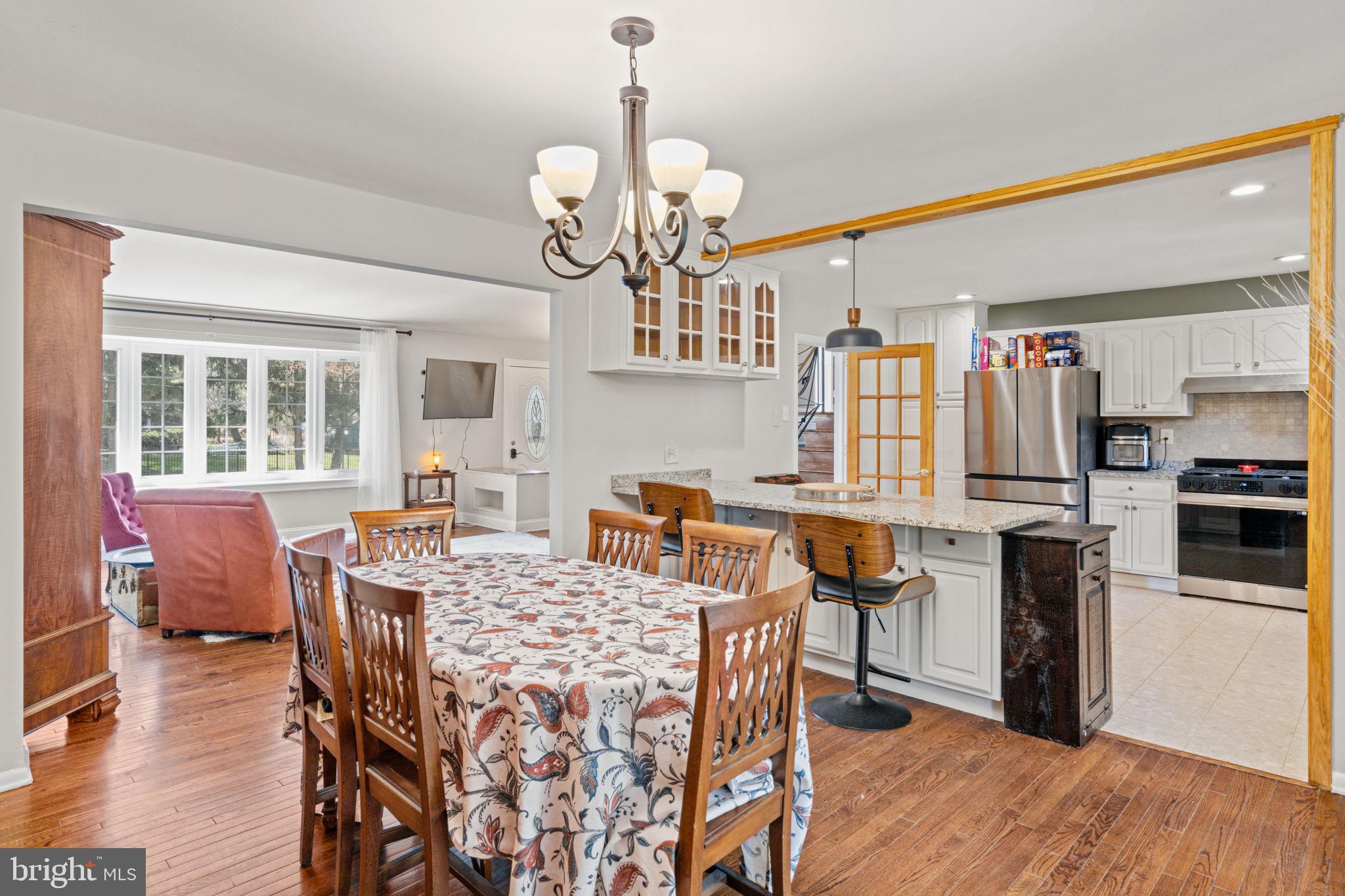 1505 Redwood Lane Wyncote, PA 19095 - Photo 8 of 51 a view of a dining room with furniture and a chandelier