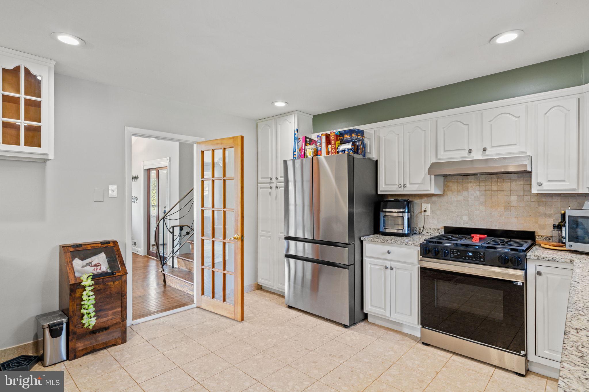 1505 Redwood Lane Wyncote, PA 19095 - Photo 10 of 51 a kitchen with stainless steel appliances granite countertop a refrigerator and a stove top oven