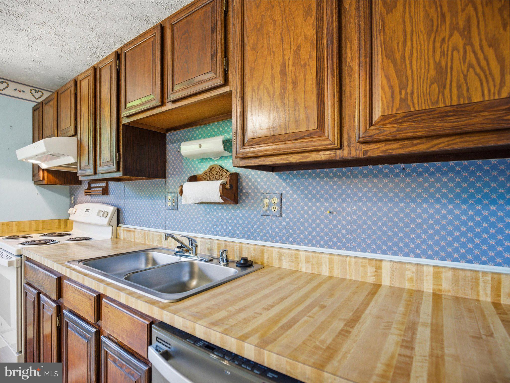 6314 West Vein Road Bowie, MD 20720 - Photo 13 of 28 a kitchen with a sink and cabinets