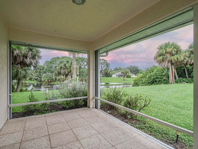 a view of a porch and garden