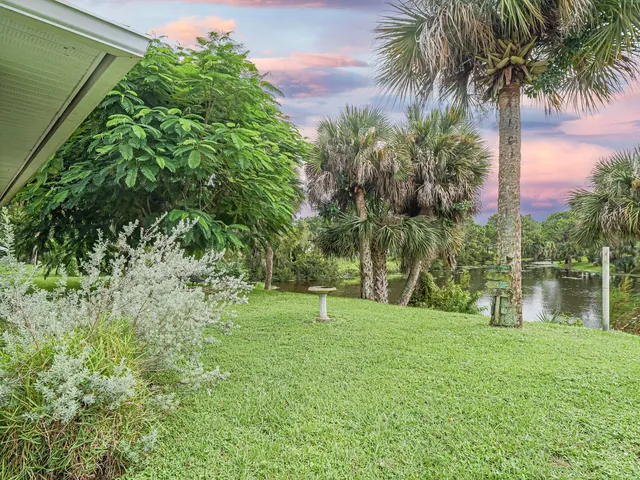 a backyard of a house with lots of green space