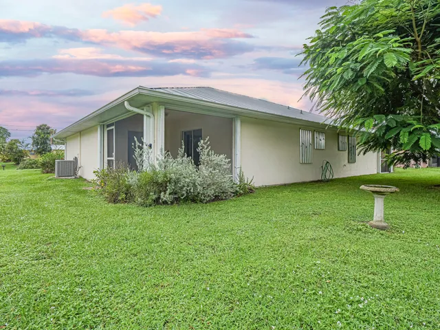 a view of a house with a garden