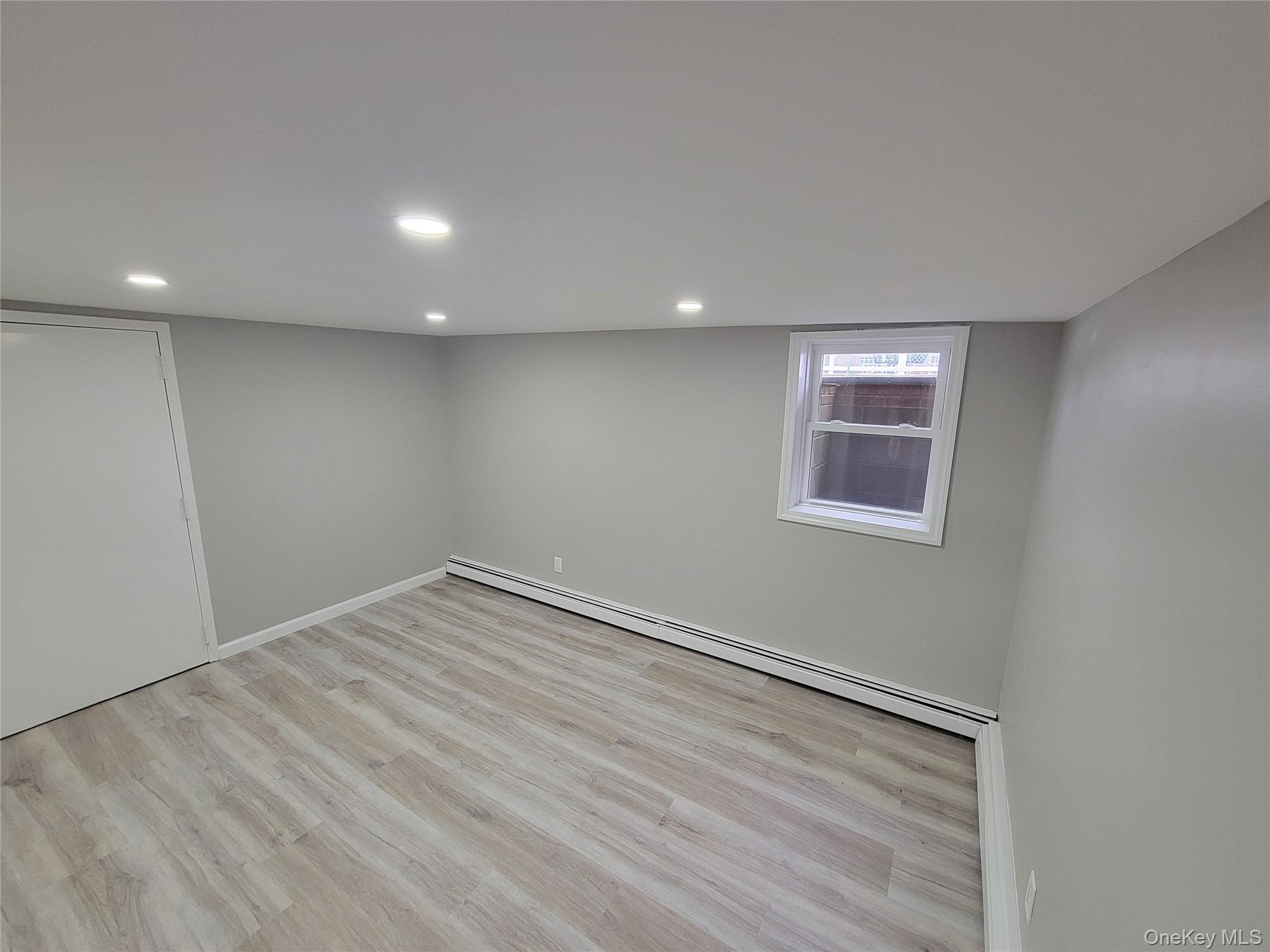 96 Hallock Landing Road Rocky Point, NY 11778 - Photo 5 of 13 a view of empty room with wooden floor